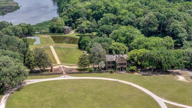 aerial view of property and surrounding area with a nearby body of water