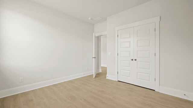 205 Bilge Rd, Ridgeville, SC 29472 - unfurnished bedroom featuring light wood-type flooring and a closet