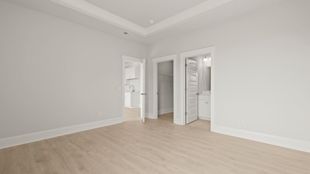 205 Bilge Rd, Ridgeville, SC 29472 - unfurnished bedroom with light wood-type flooring, a spacious closet, a closet, and connected bathroom