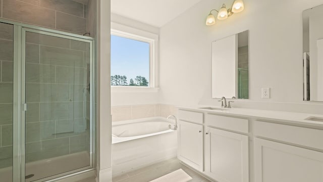 205 Bilge Rd, Ridgeville, SC 29472 - full bath featuring double vanity, a garden tub, and a stall shower