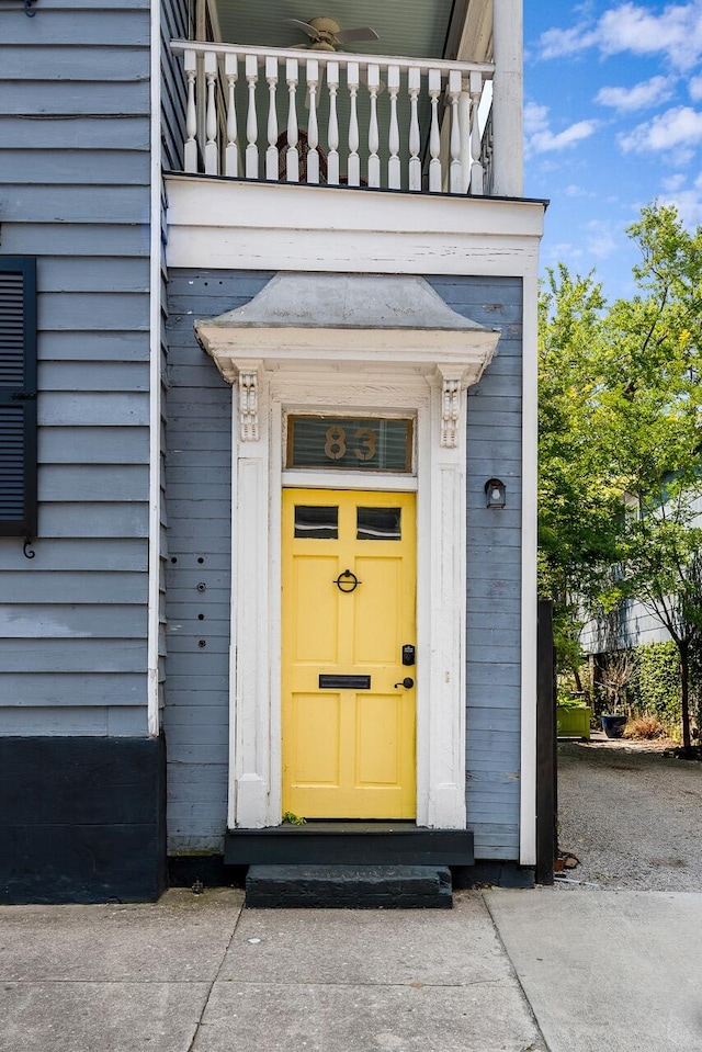 entrance to property with a balcony