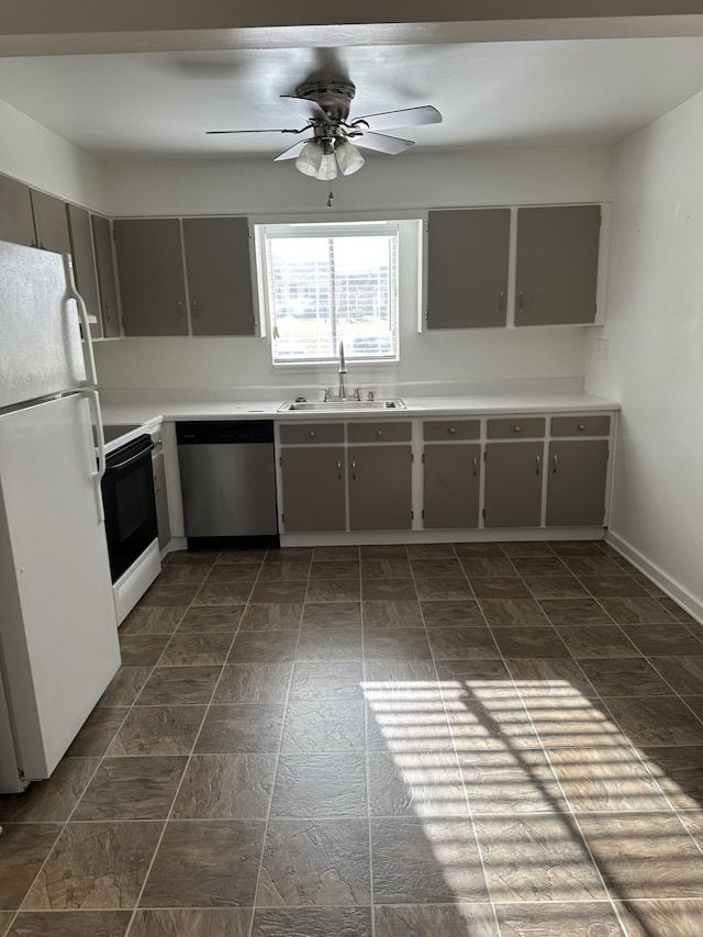 kitchen with electric range oven, sink, stainless steel dishwasher, gray cabinets, and white fridge