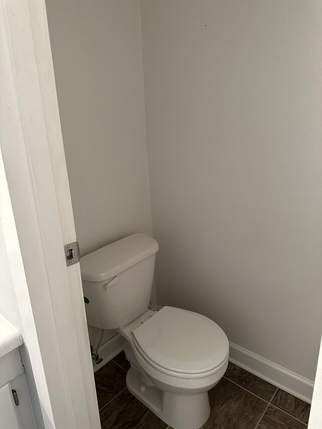 bathroom with tile patterned floors and toilet