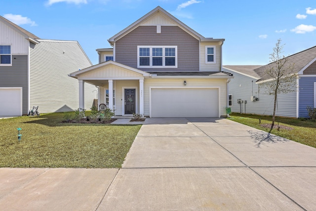 craftsman-style home with a front lawn, an attached garage, and driveway