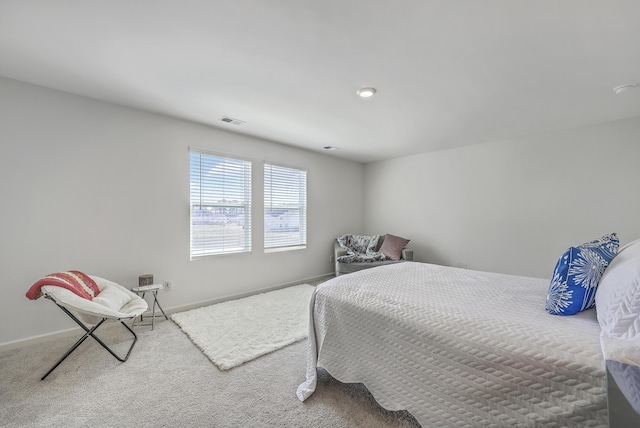 bedroom with visible vents, baseboards, and carpet floors