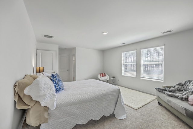 bedroom featuring visible vents, baseboards, and carpet flooring