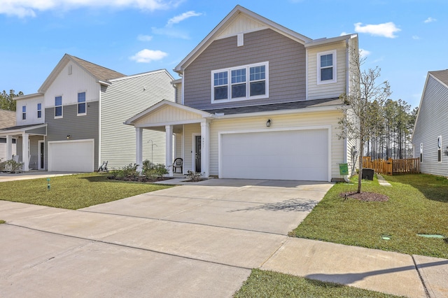 traditional-style house featuring a garage, concrete driveway, a front lawn, and fence