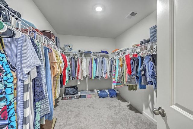 spacious closet featuring visible vents and carpet