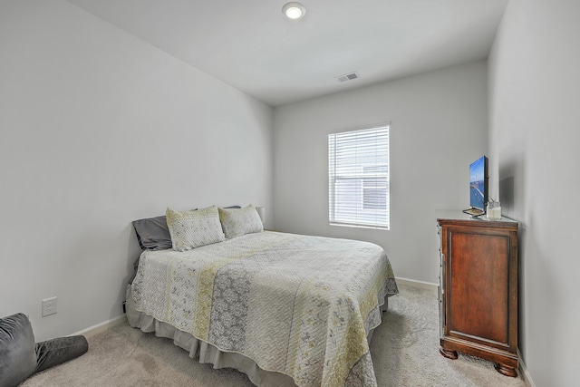 bedroom featuring visible vents, baseboards, and carpet floors