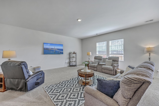 living room with visible vents, baseboards, and carpet floors