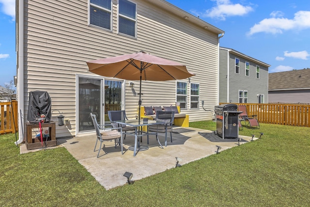 view of patio featuring area for grilling and fence