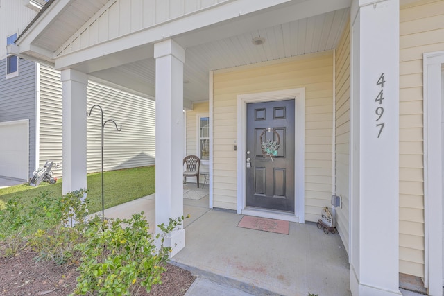 property entrance featuring a porch