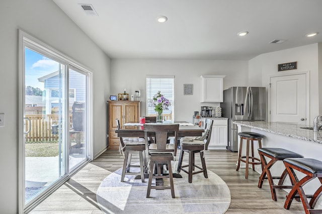 dining room with visible vents, recessed lighting, and light wood-style floors