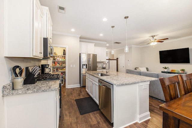 4117 Rigsby Ln, Charleston, SC 29414 - kitchen with appliances with stainless steel finishes, white cabinetry, ceiling fan, ornamental molding, and an island with sink