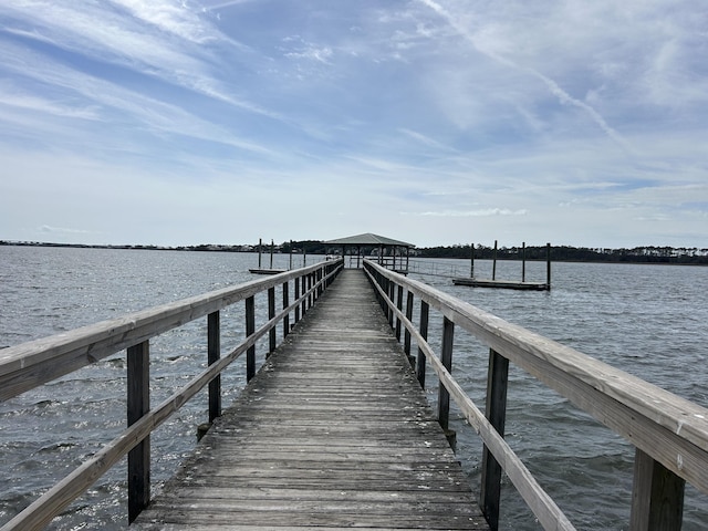 view of dock with a water view and a gazebo