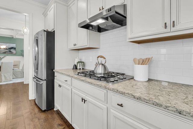 kitchen featuring dark wood-type flooring, white cabinets, crown molding, appliances with stainless steel finishes, and light stone counters