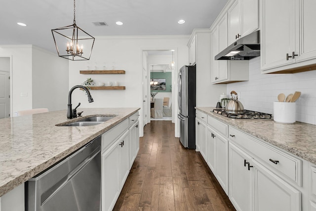 kitchen with light stone countertops, sink, dark hardwood / wood-style floors, white cabinets, and appliances with stainless steel finishes