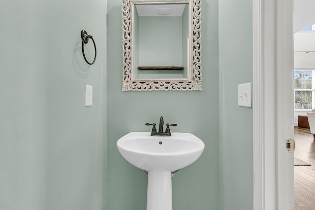 bathroom featuring hardwood / wood-style floors and sink