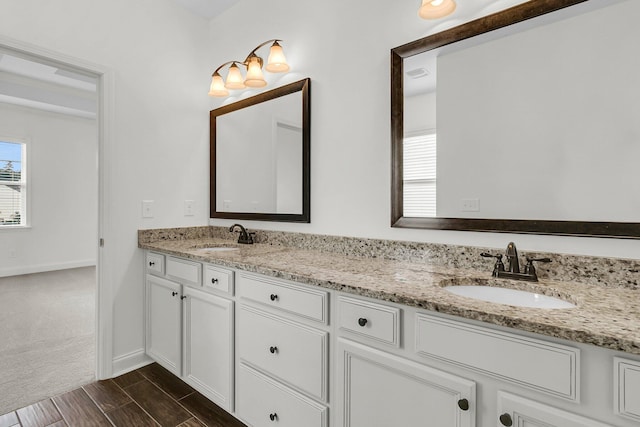 bathroom with vanity and hardwood / wood-style flooring