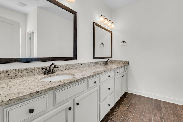 bathroom featuring wood-type flooring and vanity