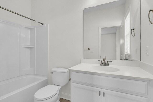 full bathroom featuring vanity,  shower combination, and toilet