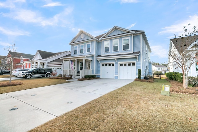 view of front of house featuring a garage and a front lawn