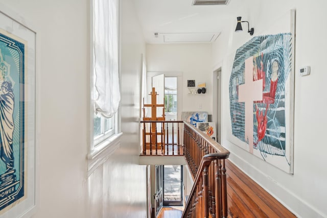 hallway with hardwood / wood-style flooring