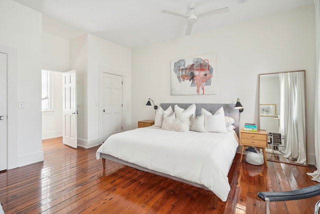 bedroom with ceiling fan and hardwood / wood-style flooring