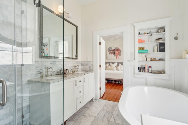 bathroom featuring vanity, hardwood / wood-style flooring, and independent shower and bath