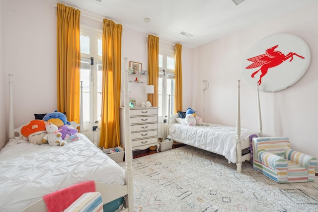 bedroom featuring multiple windows