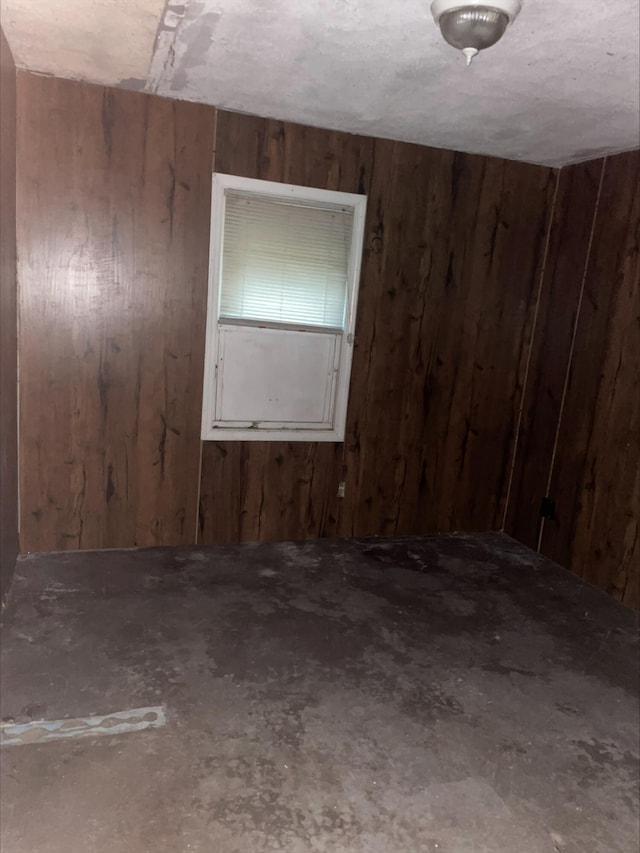 empty room with wood walls