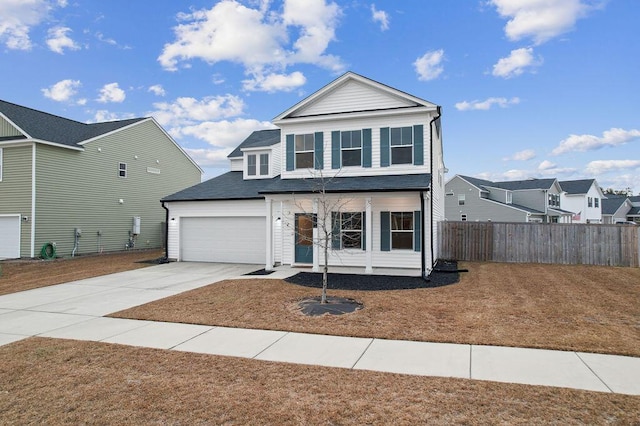 view of property with a porch and a garage