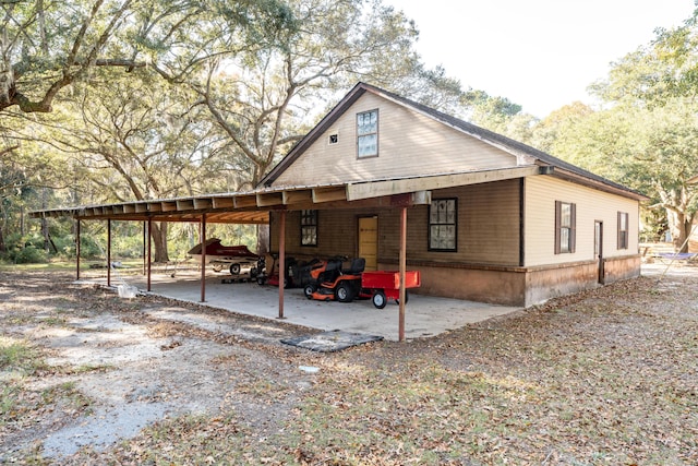 exterior space with a carport