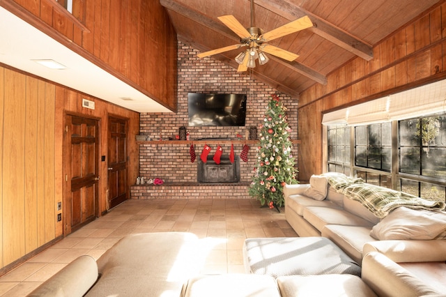 unfurnished living room featuring vaulted ceiling with beams, ceiling fan, wooden ceiling, and wood walls