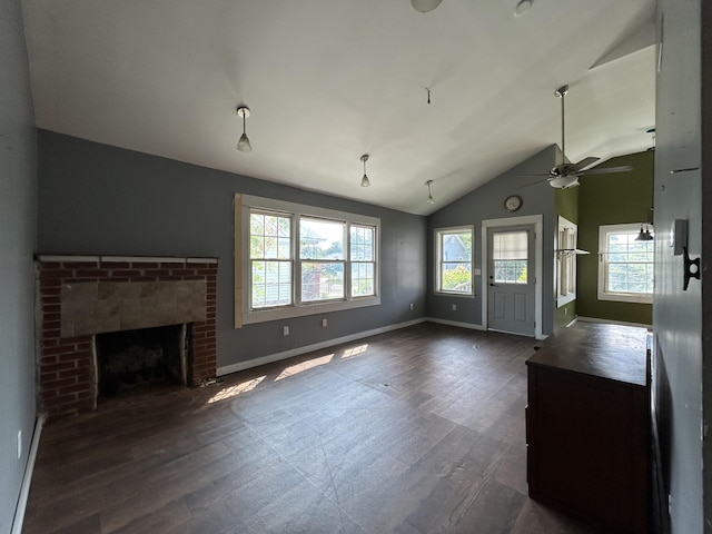 2204 Dover St, North Charleston, SC 29405 - unfurnished living room featuring dark wood-style flooring, baseboards, a brick fireplace, a ceiling fan, and vaulted ceiling