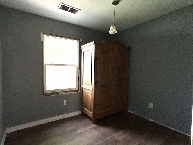 2204 Dover St, North Charleston, SC 29405 - unfurnished bedroom with dark wood-type flooring and baseboards