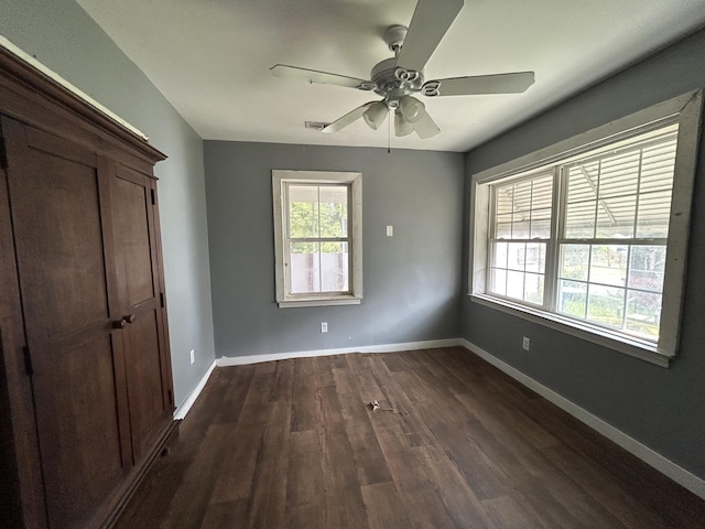 2204 Dover St, North Charleston, SC 29405 - unfurnished bedroom featuring dark wood-style floors, baseboards, and ceiling fan