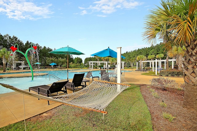 community pool featuring a pergola