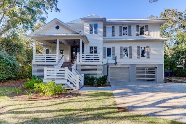 2414 Goldbug Ave, Sullivans Island, SC 29482 - view of front of property featuring stairs, a ceiling fan, a garage, and driveway