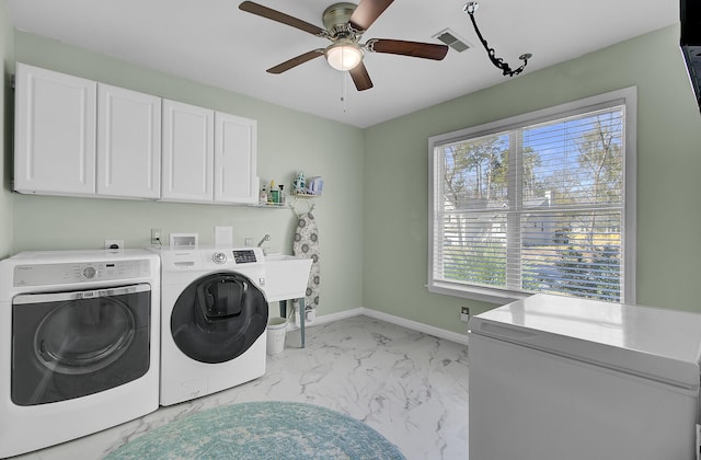 washroom with visible vents, baseboards, cabinet space, washing machine and dryer, and marble finish floor