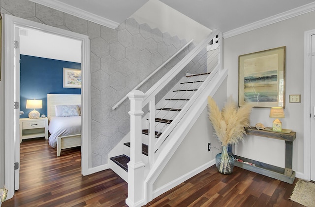 stairway featuring crown molding, baseboards, and wood finished floors