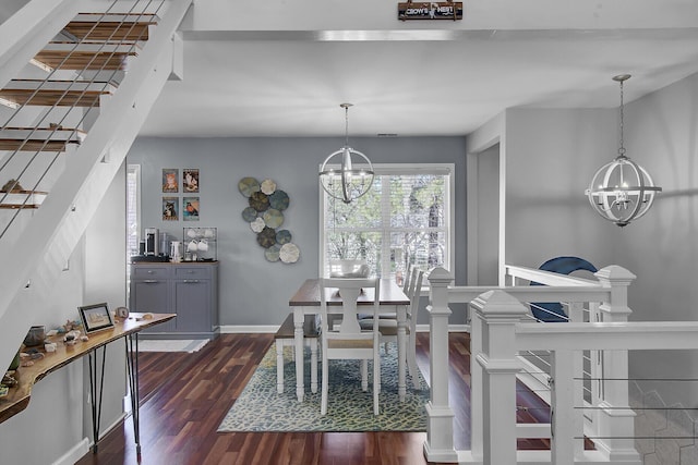 dining space with baseboards, a notable chandelier, and dark wood-style flooring