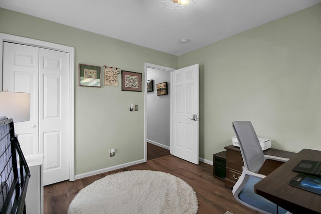 home office with dark wood finished floors and baseboards