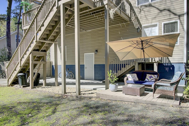 exterior space featuring stairway, an outdoor hangout area, and a patio