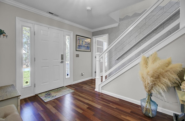 foyer featuring stairway, a healthy amount of sunlight, and crown molding