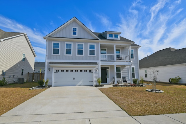 view of front facade with a porch, concrete driveway, an attached garage, a front yard, and cooling unit