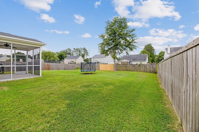 405 Watershed Dr, Goose Creek, SC 29445 - view of yard featuring a trampoline, ceiling fan, a sunroom, and a residential view