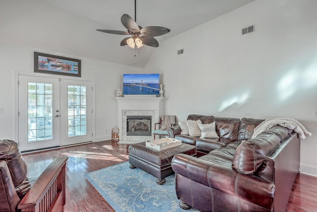 living room featuring ceiling fan, high vaulted ceiling, dark hardwood / wood-style flooring, and french doors