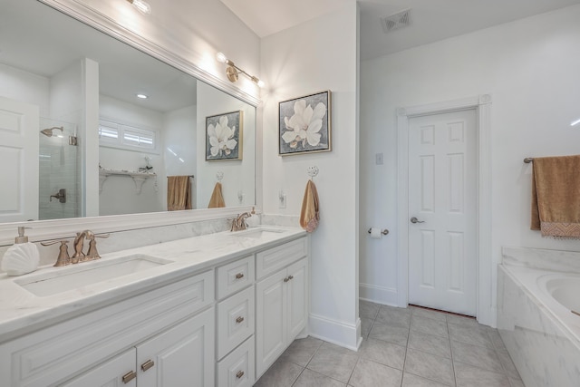 bathroom with tile patterned flooring, shower with separate bathtub, and vanity