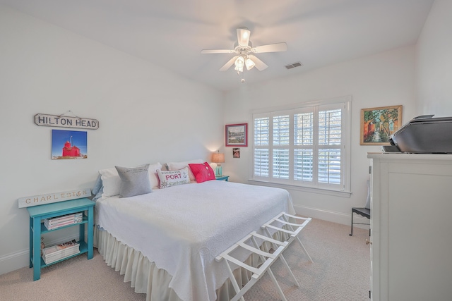 bedroom with light colored carpet and ceiling fan